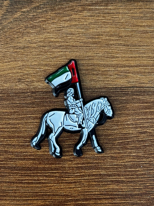 شارة فارس الخيل مع علم الإمارات العربية المتحدة